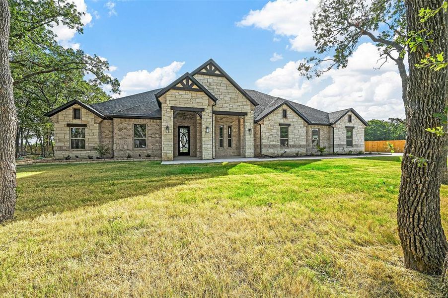 View of front of house with a front lawn