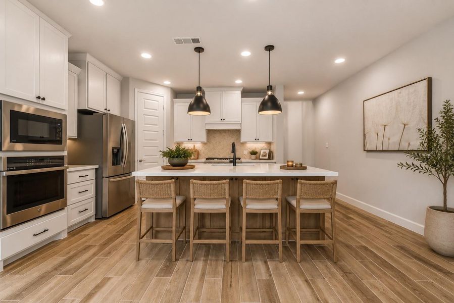 A spacious breakfast bar provides additional seating, perfect for casual dining, morning coffee, or entertaining guests. *VIRTUALLY STAGED