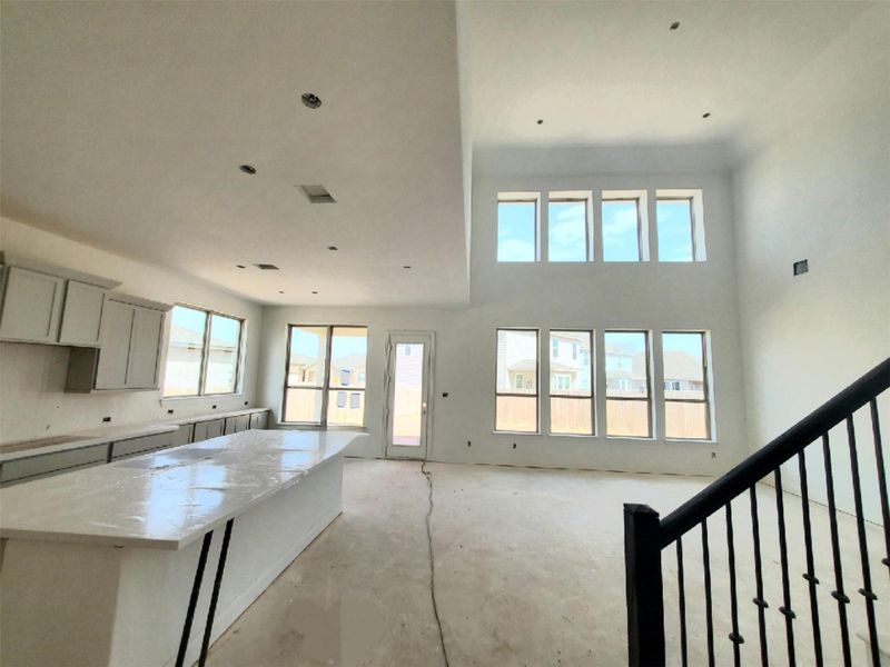 Kitchen featuring a center island and a high ceiling