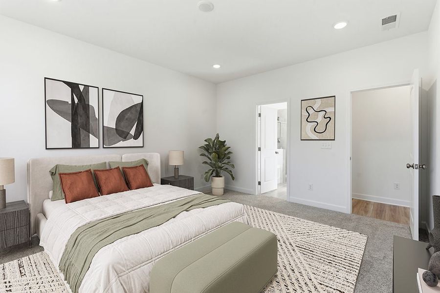 A bedroom with a bed and a plant on the side.