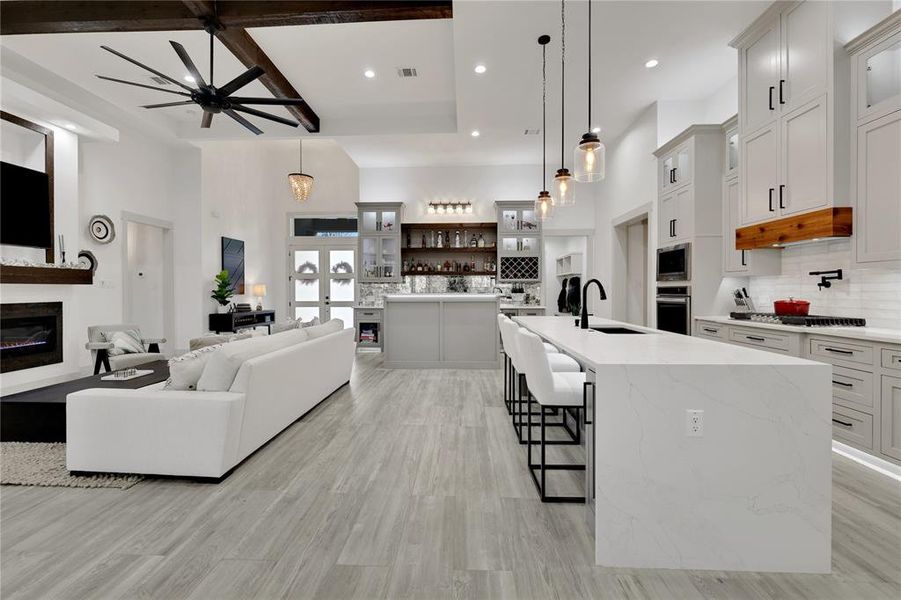 View from the dining area through the kitchen to the entertainment bar area.