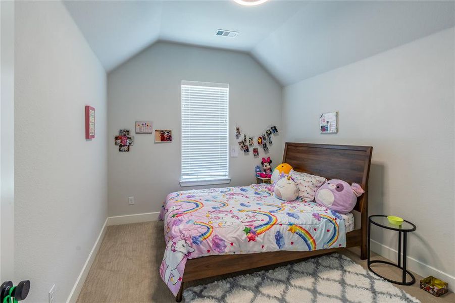 Bathroom featuring vanity, shower / bath combo, and a textured wall