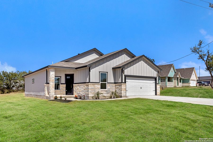 Front exterior of a new home in , San Antonio, TX, highlighting curb appeal (Image 16). Front exterior of a new home in , San Antonio, TX, highlighting curb appeal (Image 16).