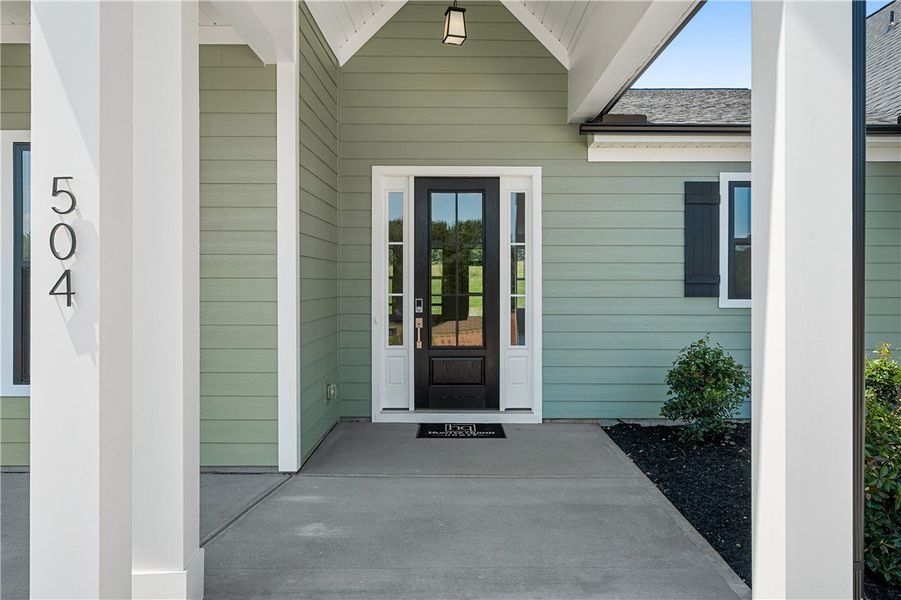 A welcoming front entrance featuring a panel door A welcoming front entrance featuring a panel door