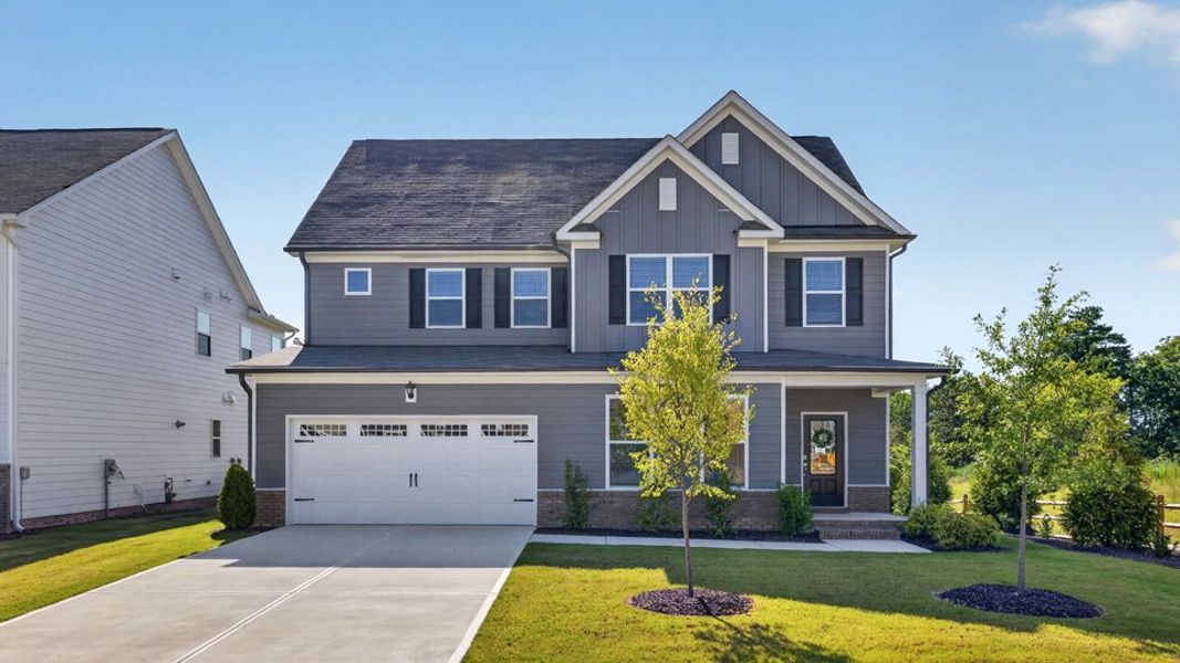 Representative exterior photo of a completed home built from the Lucas by D.R. Horton in The Manors at Haywood Glen, Knightdale, NC (Image 27).