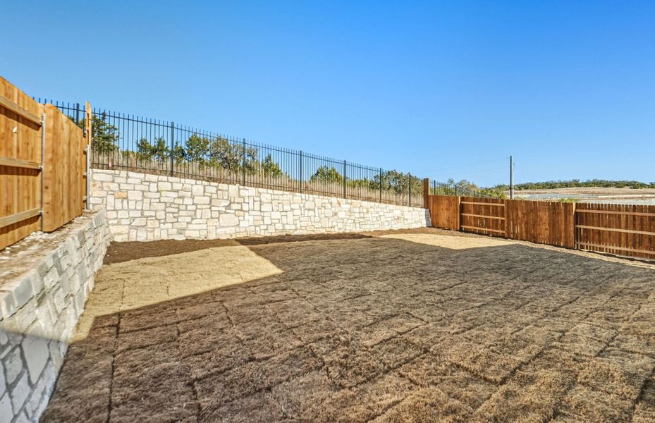 Exterior details and patio area of a home in West Cypress Hills, Spicewood (Image 4).