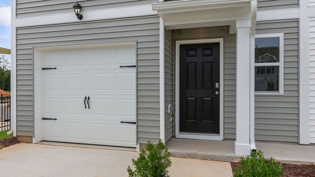 Exterior details and patio area of a home in The Townes at Hunter Hill, Rocky Mount (Image 3).