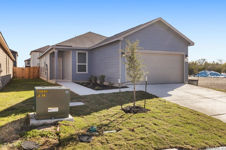 Front exterior of a new home in Spanish Trails, San Antonio, TX, highlighting curb appeal (Image 21). Front exterior of a new home in Spanish Trails, San Antonio, TX, highlighting curb appeal (Image 21).