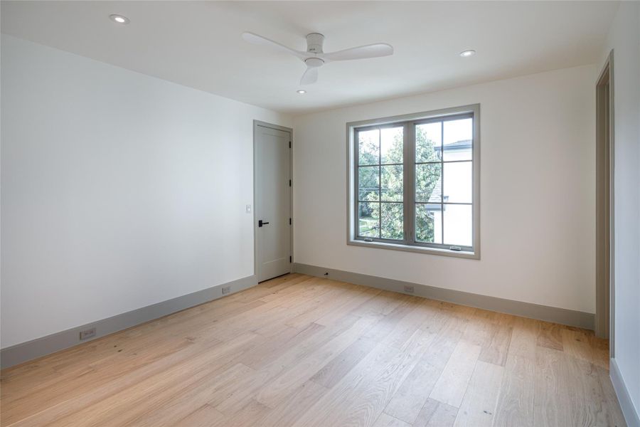 Another upstairs bedroom with generous proportions and plenty of natural light—complete with its own ensuite bath finished with the same attention to detail found throughout the home.