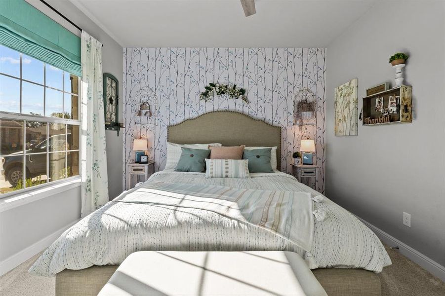 Bedroom featuring carpet floors and ceiling fan