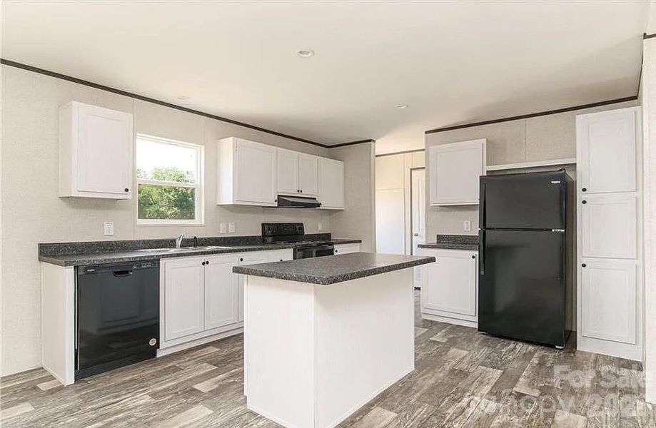 Furnished interior view inside a new home in , Lenoir (Image 5).