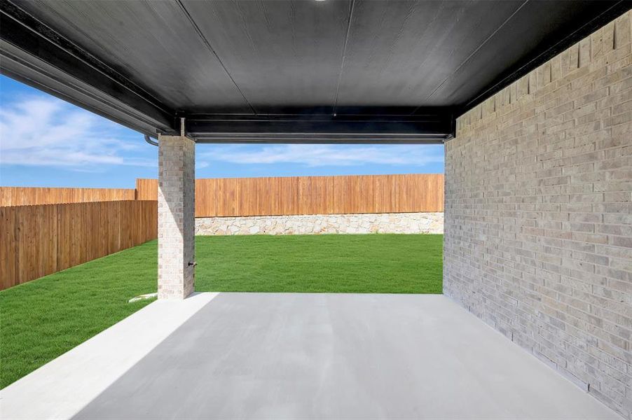 Exterior details and patio area of a home in Elevon, Lavon (Image 3).