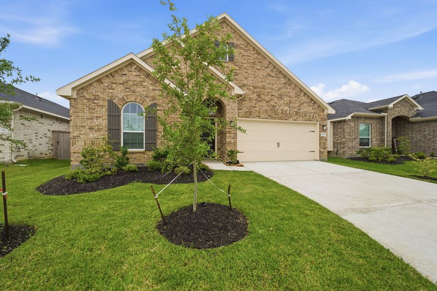 Front exterior of a new home in Mulberry Farms, Santa Fe, TX, highlighting curb appeal (Image 2). Front exterior of a new home in Mulberry Farms, Santa Fe, TX, highlighting curb appeal (Image 2).
