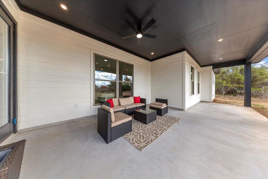 View of patio / terrace with a ceiling fan and an outdoor hangout area View of patio / terrace with a ceiling fan and an outdoor hangout area