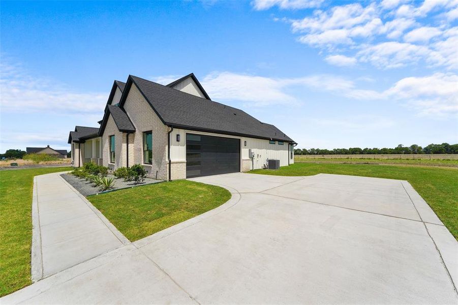 Front exterior of a new home in , Caddo Mills, TX, highlighting curb appeal (Image 26).