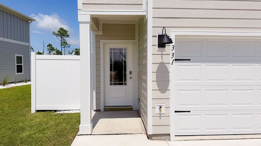 Exterior details and patio area of a home in WindMark Beach, Port Saint Joe (Image 3).