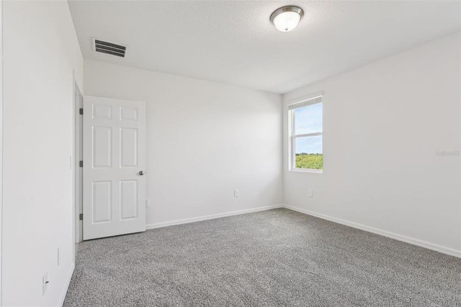 Spacious, unfurnished interior of a new home in Lake Deer Estates - Signature Series, Poinciana (Image 30).