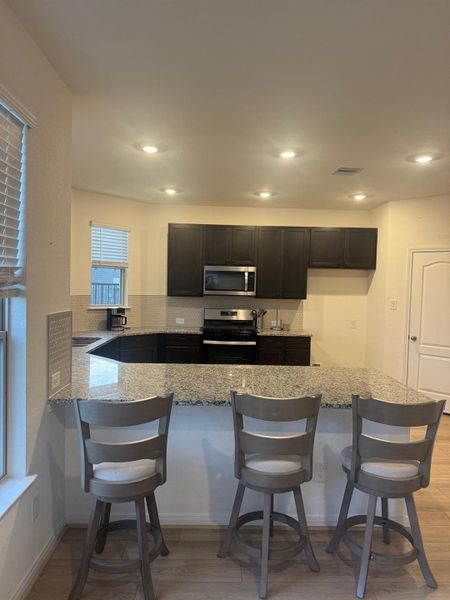 Furnished interior view inside a new home in Sunterra, Katy (Image 10).