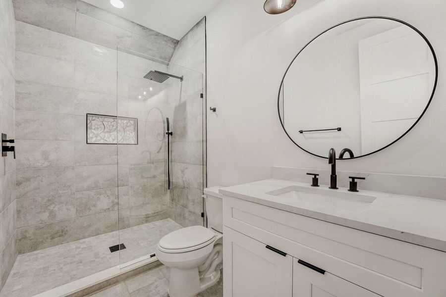Full bathroom with vanity and walk in shower