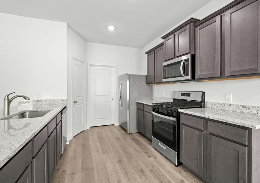 The kitchen of the Cypress has gorgeous wood cabinetry. The kitchen of the Cypress has gorgeous wood cabinetry.