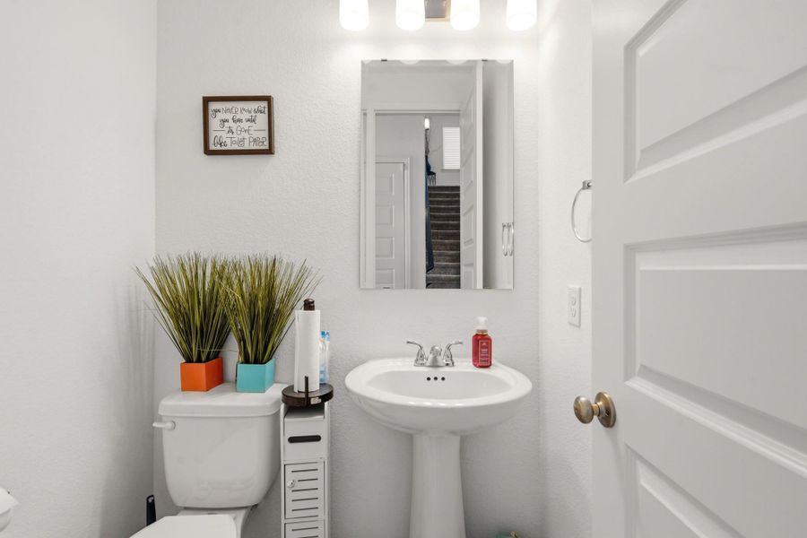 Convenient first-floor powder room with tasteful finishes