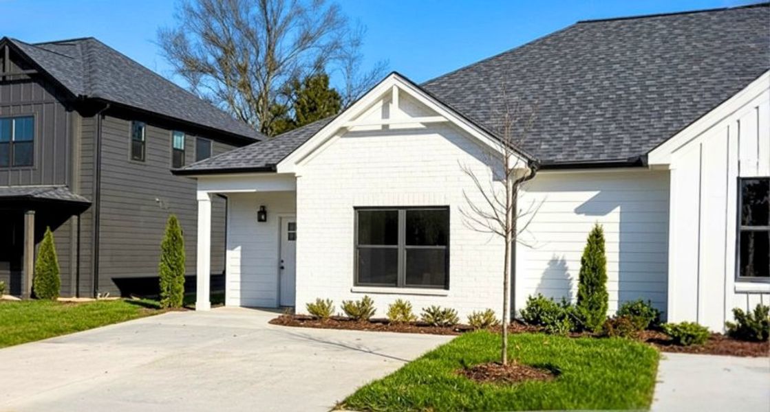 Front exterior of a new home in The Nassau, Chattanooga, TN, highlighting curb appeal (Image 24). Front exterior of a new home in The Nassau, Chattanooga, TN, highlighting curb appeal (Image 24).