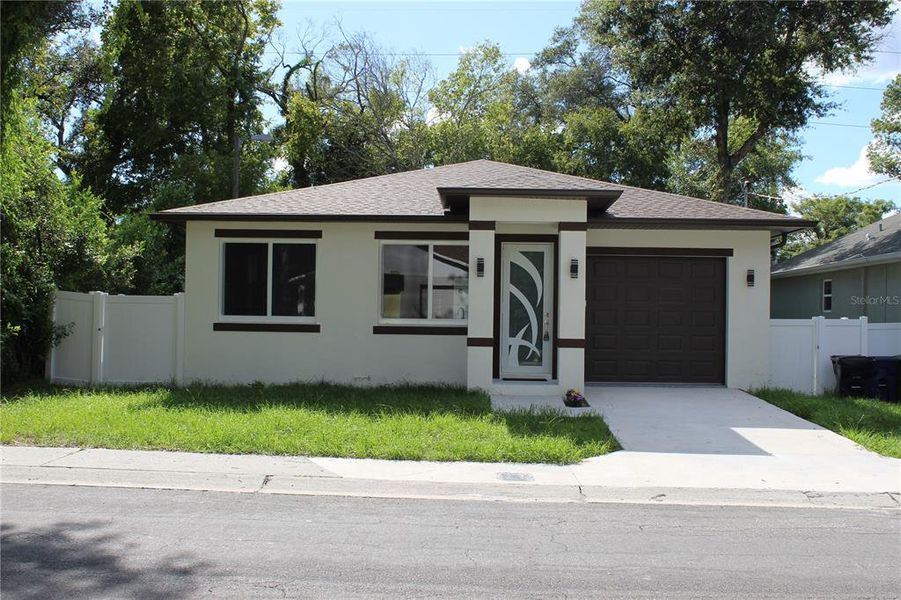 Front exterior of a new home in , Tampa, FL, highlighting curb appeal (Image 22).