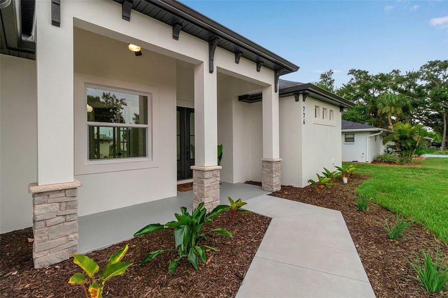 Front exterior of a new home in , Venice, FL, highlighting curb appeal (Image 25).