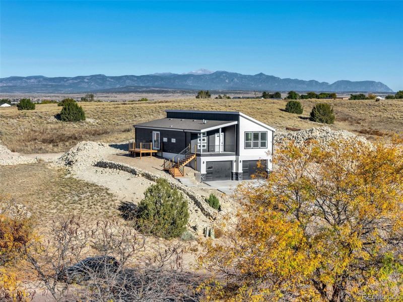 Front Elevation – Showcasing the home’s bold design, attached garage, and welcoming covered entry. Front Elevation – Showcasing the home’s bold design, attached garage, and welcoming covered entry.