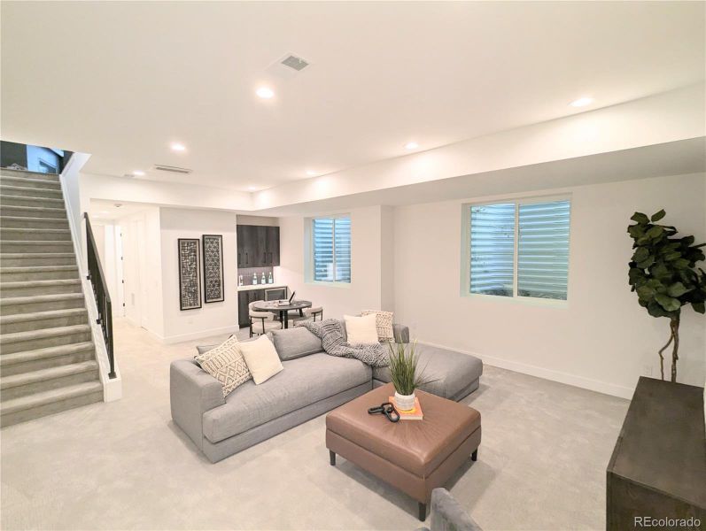 Basement rec room with soaring ceilings