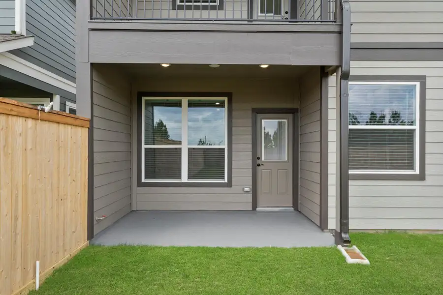 Exterior details and patio area of a home in Bridgeland, Cypress (Image 17).