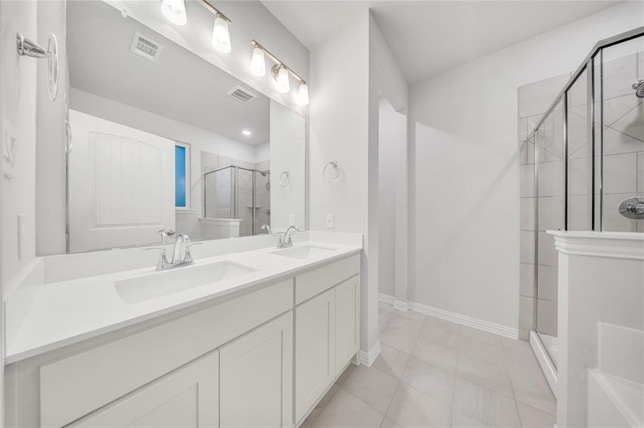 Bathroom with a shower stall and double vanity Bathroom with a shower stall and double vanity
