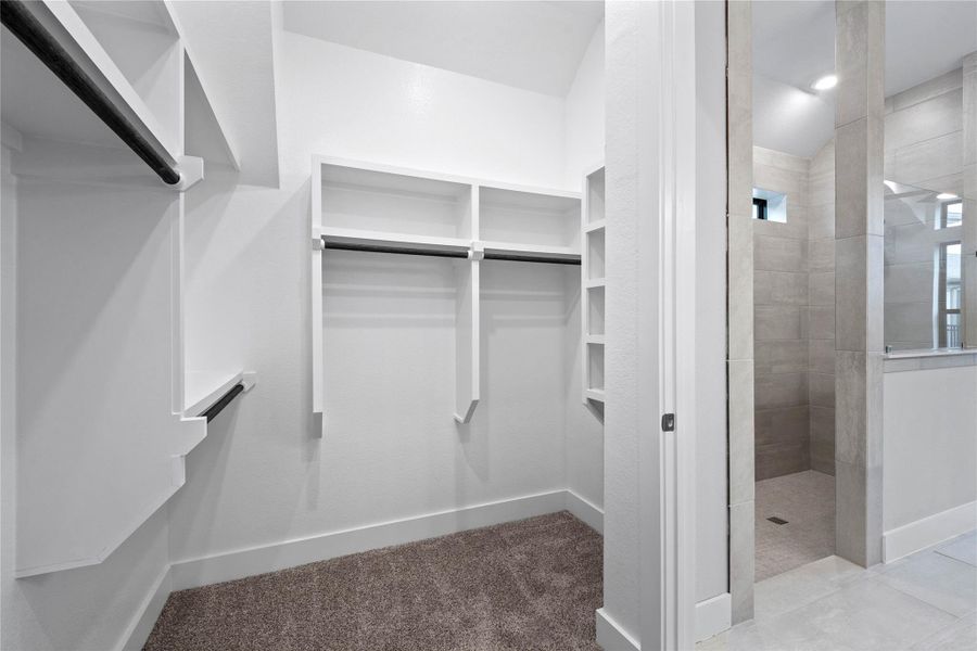 This is an organizer's dream! The immaculate closet features extensive high shelving and multiple tiers of hanging space, ensuring you'll have more than enough room for your entire wardrobe and all of your belongings.