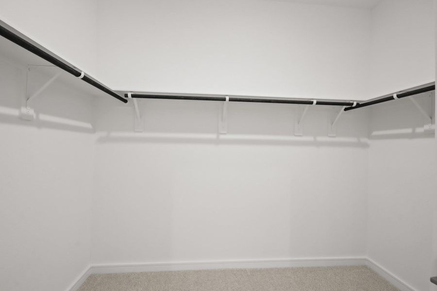 Walk-in closet in the primary suite (*Photo not of actual home and used for illustration purposes only.)