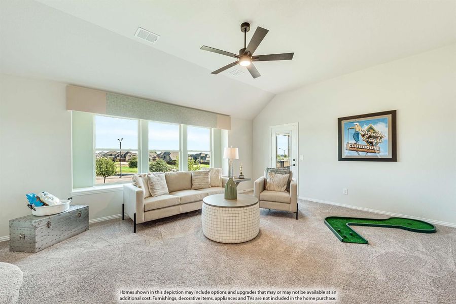 Bonus room with vaulted ceiling, ceiling fan, carpet flooring, and large windows overlooking neighborhood