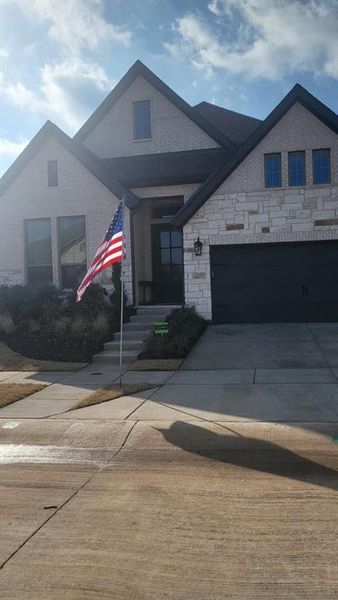 Front exterior of a new home in , Van Alstyne, TX, highlighting curb appeal (Image 1). Front exterior of a new home in , Van Alstyne, TX, highlighting curb appeal (Image 1).