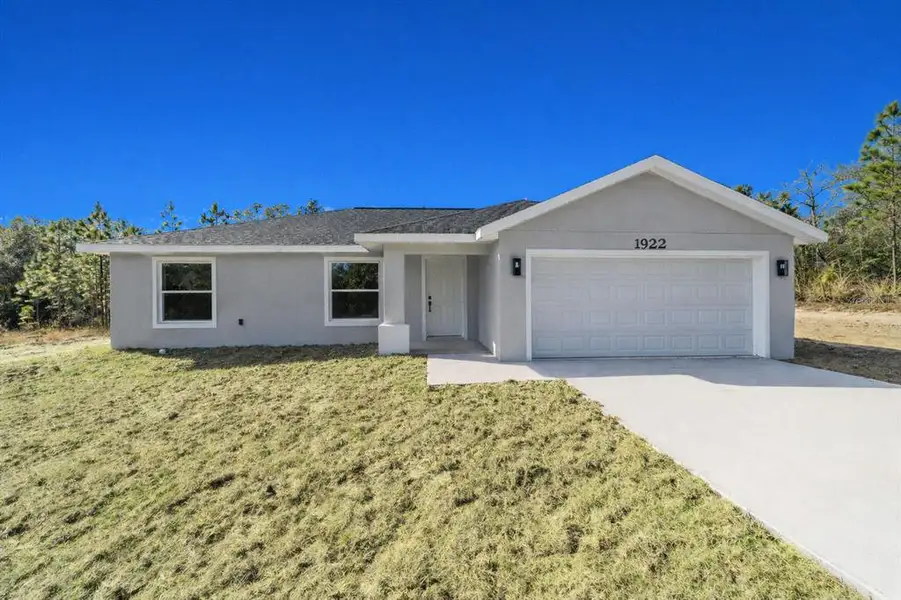 Front exterior of a new home in , Dunnellon, FL, highlighting curb appeal (Image 1). Front exterior of a new home in , Dunnellon, FL, highlighting curb appeal (Image 1).