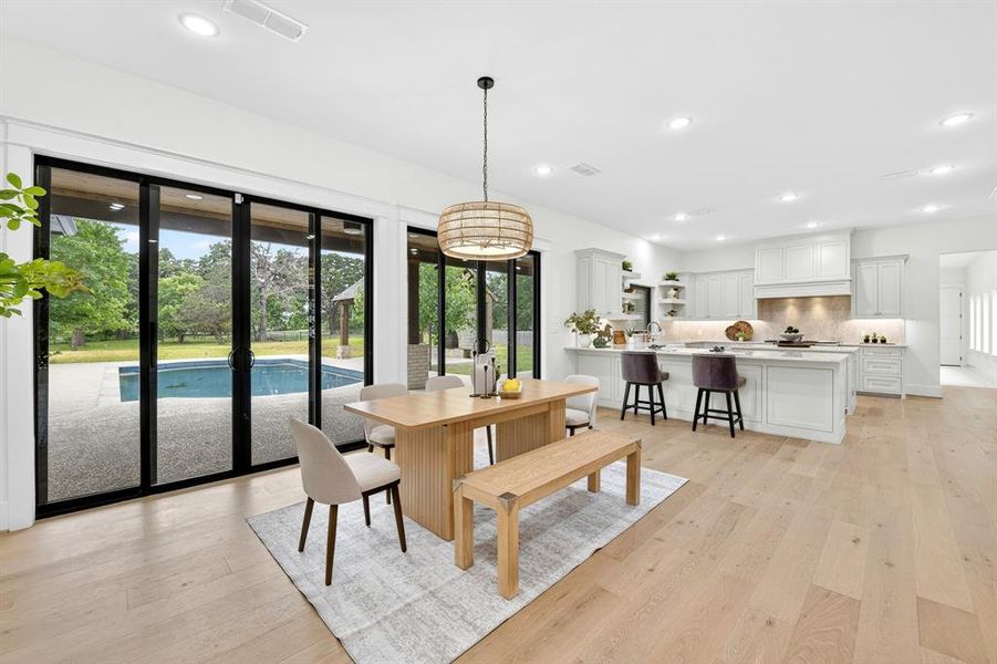 Dining room that is open to the kitchen with great access to enjoy the gorgeous backyard views!