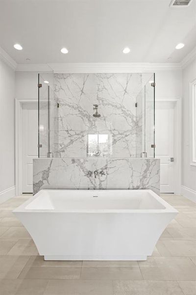 Full bath featuring crown molding, recessed lighting, a freestanding tub, and a marble finish shower Full bath featuring crown molding, recessed lighting, a freestanding tub, and a marble finish shower