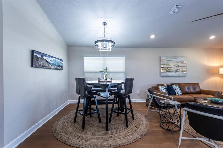 dining area open to living room and kitchen