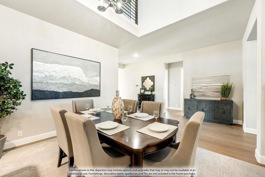 Formal dining room with dark wood table, six upholstered chairs, high ceilings, and hardwood floors