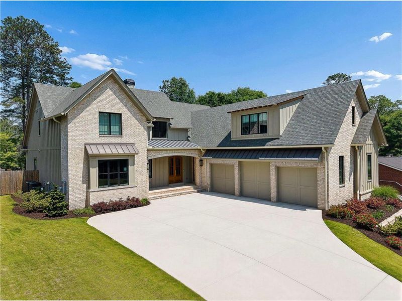 Front exterior of a new home in , Smyrna, GA, highlighting curb appeal (Image 2). Front exterior of a new home in , Smyrna, GA, highlighting curb appeal (Image 2).