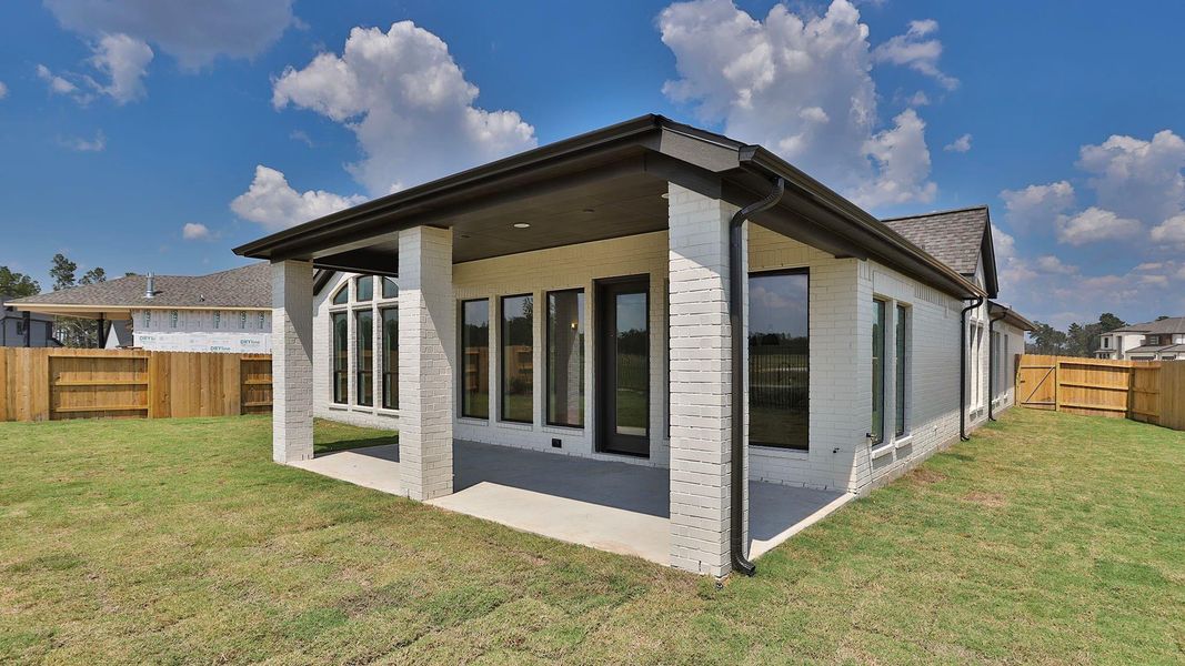 Front exterior of a new home in Artavia 55' - Valencia, Conroe, TX, highlighting curb appeal (Image 1). Front exterior of a new home in Artavia 55' - Valencia, Conroe, TX, highlighting curb appeal (Image 1).