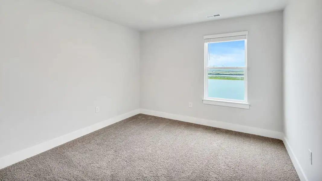 Spacious, unfurnished interior of a new home in The Townes at Cedar Hill Landing, Navassa (Image 26).