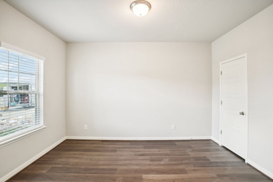 Guest bedroom of the Reynolds floorplan at a Meritage Homes community.