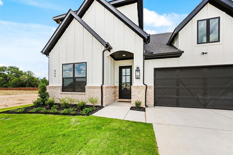 Front exterior of a new home in Parks of Aledo, Aledo, TX, highlighting curb appeal (Image 21).