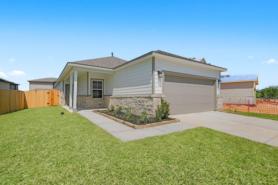 Front exterior of a new home in Granger Pines, Conroe, TX, highlighting curb appeal (Image 18).