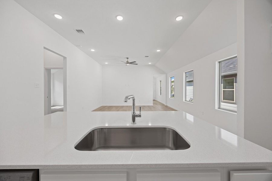 Kitchen in the Cypress home plan by Trophy Signature Homes – REPRESENTATIVE PHOTO