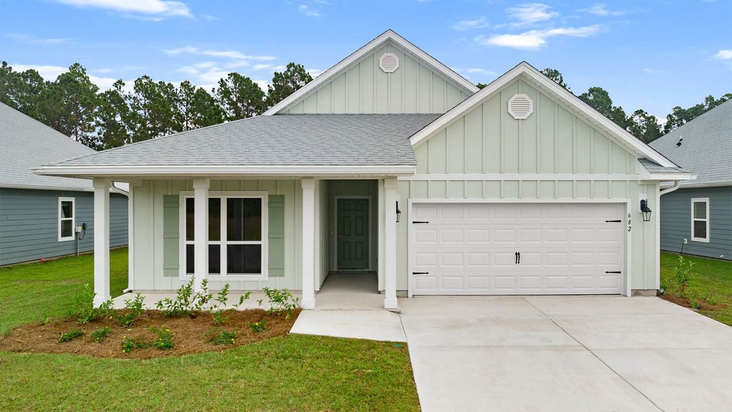 Front exterior of a new home in Buffer Farms, Port Saint Joe, FL, highlighting curb appeal (Image 1). Front exterior of a new home in Buffer Farms, Port Saint Joe, FL, highlighting curb appeal (Image 1).
