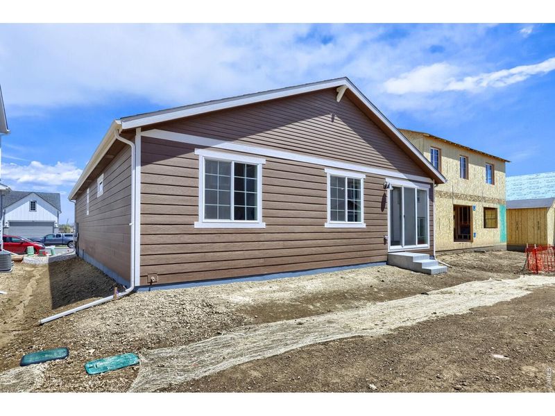Exterior details and patio area of a home in Farmstead, Berthoud (Image 4).